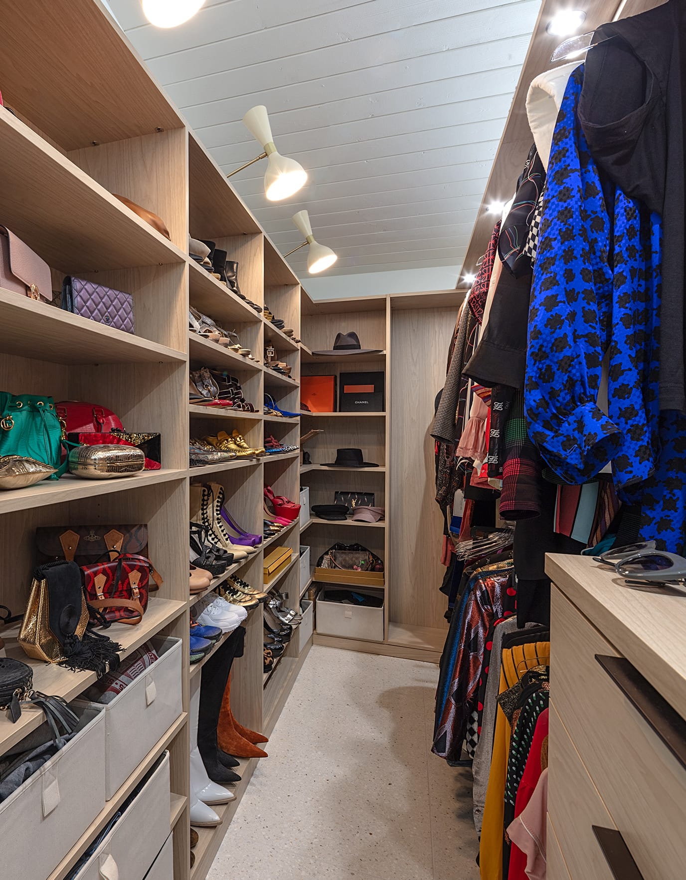 Custom closet designed for Matt Sorum and Ace Harper with open shelving, dresser drawers and shoe storage by California Closets