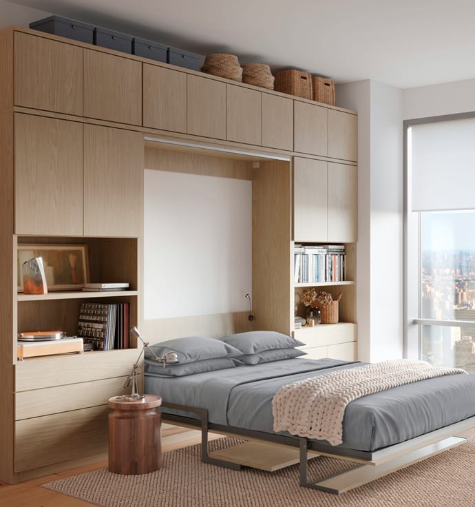 Queen Murphy bed floor to ceiling built in storage cabinets and shelving for storage by California Closets