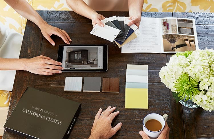 Showroom consultation with customer going over design options at California Closets