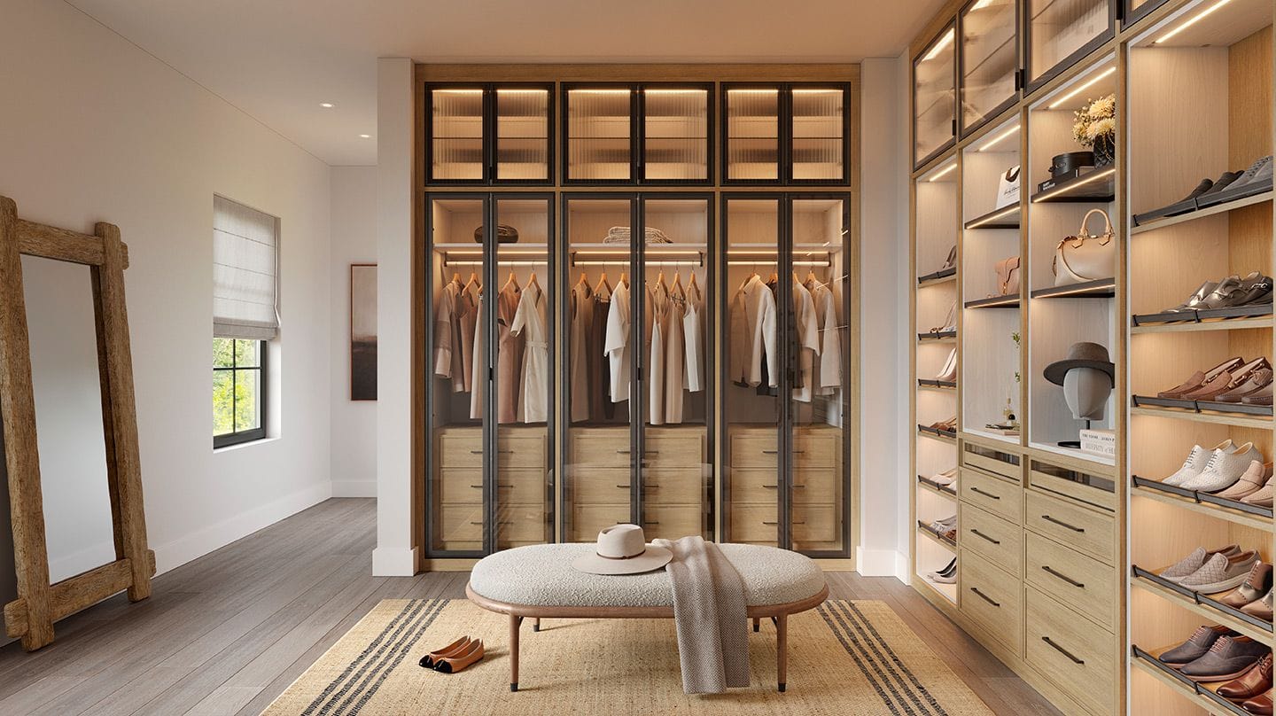 Walk in closet design with row of windows along wall for natural light from California Closets