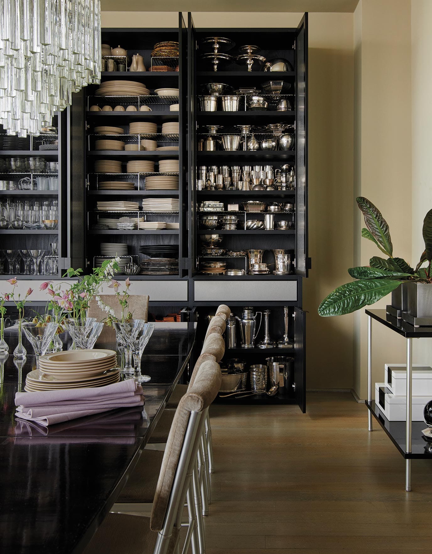 Kevin Sharkey's collections of silver, china and glass that he uses for these occasions are housed in his California Closets built cabinet